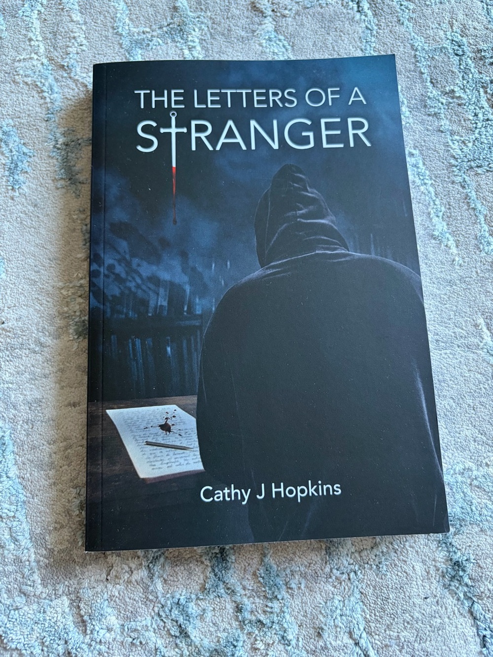 The Letters of a Stranger by Cathy J Hopkins - Black & Dark Blue Cover